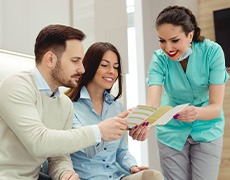 Dental patients consulting their dentist about dental insurance