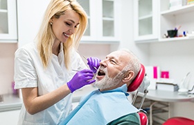 An older man having his teeth cleaned