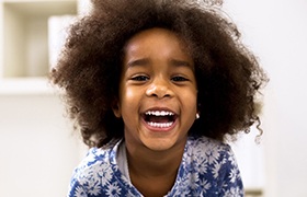 A little girl smiling