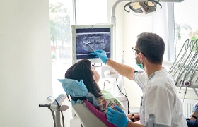 dentist showing a patient their X-rays