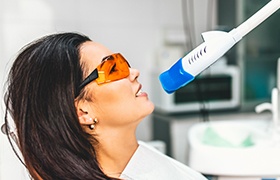 Woman receiving in-office teeth whitening