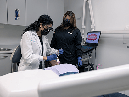 young woman admiring her new dental crowns in New Bedford