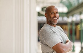 Confident man with dental implants in New Bedford smiles