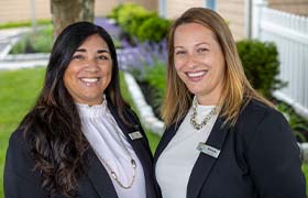 Dental team members smiling in New Bedford