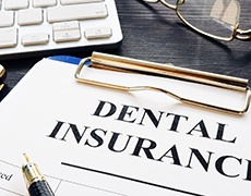 Dental insurance paperwork for cost of dental implants in New Bedford