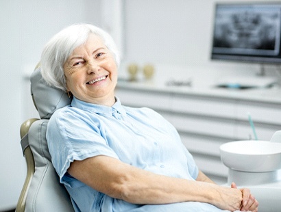 Woman using dental insurance in New Bedford