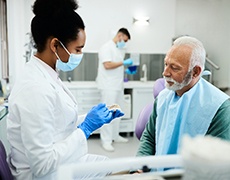 dentist explaining dentures in New Bedford