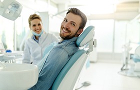 Patient using calculator and filling out paperwork