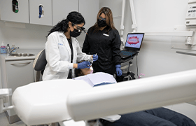 Woman calling her New Bedford emergency dentist