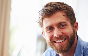 Man smiling on white background