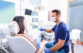 Dentist and patient talking in dental office