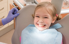 Little girl smiling in dental chair