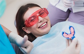 Woman in dental chair smiling