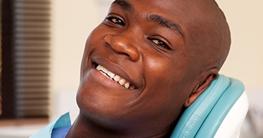 Smiling man in dental chair