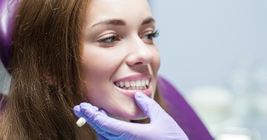 Dentist looking at patient's smile